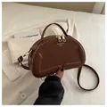 Vintage brown quilted crescent shoulder bag with golden zippers and detachable strap - Brown