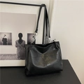 Large black vintage tote bag with geometric textured leather panels and silver chain strap - Black