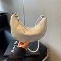 Minimalist white leather crescent shoulder bag with knot detail and vertical stitching - Off White