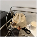 Chic beige nylon drawstring bucket bag with cute brown plush monster charm and black strap - Khaki (With Plush Pendant)
