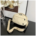 Detail of light beige nylon messenger bag with smooth zippers and adjustable strap - Khaki