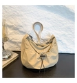 Minimalist beige nylon crossbody bag featuring a ruched drawstring design and wide strap - Khaki