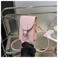 Detailed view of a light pink leather phone bag with silver buckle on metal shelf - Pink