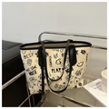 Detail of street graffiti tote bag featuring bold black prints on off-white material - Black Without Pendant