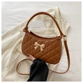 Brown quilted crossbody bag with a gold metal bow detail and elegant top handle - Brown