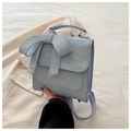 Light blue preppy style backpack with large bow detail and glossy crinkled texture - Blue