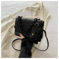 Black quilted crossbody bag with FASHION embossing and matching mini pouch accessory - Black