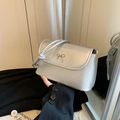 Silver faux leather shoulder bag with a metallic bow detail and a chic top handle - Silver
