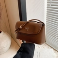 Minimalist dark brown crossbody bag with gold bow detail and knot strap for women - Brown