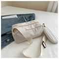 Detailed view of the white oxford crossbody bag with wide strap and mini round pouch - White