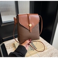 Detail of vintage crossbody phone bag with tan leather flap and gold metal buckle - Coffee
