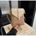 Close-up of color-block phone crossbody bag with pebbled leather and gold metal buckle - Khaki