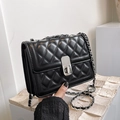 Classic black quilted leather crossbody bag with silver chain strap and metal turn-lock - Black