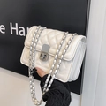 White quilted chain strap crossbody bag with elegant silver clasp closure and accordion design - White