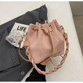 Detail of dusty rose bucket bag with woven handle and drawstring on a grey suit jacket - Pink Without Pendant