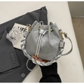 Silver drawstring bucket bag with unique metallic finish and woven shoulder strap - Silver No Pendant