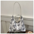 Sac fourre-tout en toile duveteuse blanche avec imprimés papillons noirs et lanière - Noir