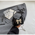 Mini black sequin crossbody bag with a large silver bow and fine chain strap for women - Black