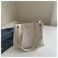 Detail of white tote bag with pleated texture, embossed lettering and chain strap - White