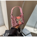 Pink sequin mini handbag featuring a silver metal bow and detachable chain strap - Pink