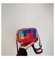 Detail of colorful geometric patchwork crossbody bag with bohemian woven strap - Rose Red