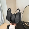 Minimalist black quilted shoulder bag with faux leather texture and silver hardware - Black
