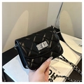 Classic black quilted crossbody bag with silver twist lock and leather chain strap - Black