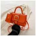 Bright orange crossbody bag set with leather texture and large gold buckle detail - Orange