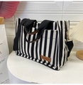 Classic black and white striped canvas tote bag with adjustable shoulder strap and leather tag - Black