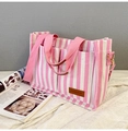 Pink and white striped canvas tote bag with shoulder strap and dual front pockets - Pink