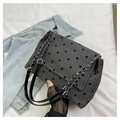 Detail of grey polka dot shoulder bag featuring textured fabric and metal chain strap - Polka Dot