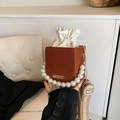 Brown pleated square bag with pearl handle and golden chain strap in 2024 trendy style - Brown