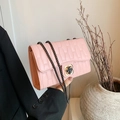 Quilted pink crossbody bag with gold floral clasp and dark metal chain strap - Pink
