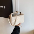 Minimalist cream woven handbag with geometric texture and elegant golden metal clasp - White