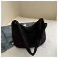 Lightweight black quilted nylon dumpling bag featuring a puff bow shoulder strap detail - Black