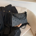 Gray herringbone crossbody bag with black polka dots and braided handle - Bow