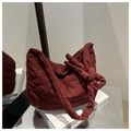 Deep red heart-quilted nylon shoulder bag with stylish knotted strap detail - Red