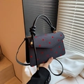 Deep grey tote bag with red polka dots and unique black knotted handle and gold hardware - Polka Dot