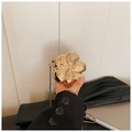 Elegant gold flower shaped metal clutch bag with a glossy mirror finish and snake chain strap - Gold