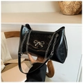 Glossy black tote bag with silver metal bow and chain strap for women - Black