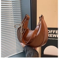 Brown semi-circle shoulder bag with oily leather finish and silver bead bow charm - Brown