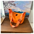 Macro shot of waterproof orange crescent bag with durable nylon texture and zippers - Orange