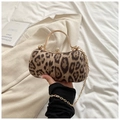 Leopard print evening clutch bag with gold handle and rhinestone clasp held by hand - Khaki