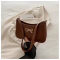 Vintage caramel brown shoulder bag with a gold metal bow detail for women - Coffee
