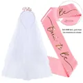 Detail of pink satin Bride To Be sash and white tulle veil with rhinestone headband - Pink Sash + Rose Gold