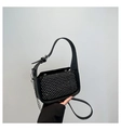 Detailed view of silver rivets on black leather handbag with metallic chain strap - Silver