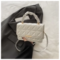 Detail of white quilted crossbody bag with cloud-like ruched handle and gold buckle closure - White