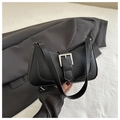 Detail of black faux leather underarm bag with silver buckle and smooth zipper - Black