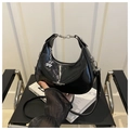 Minimalist black crescent shoulder bag in glossy patent leather with clover charm - Black