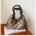 Champagne gold quilted tote bag with black straps and shiny metallic finish - Gold